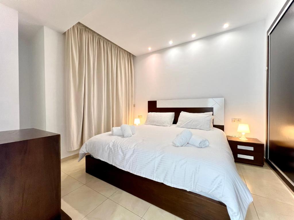 Postel nebo postele na pokoji v ubytování Blue Wave Apartment
