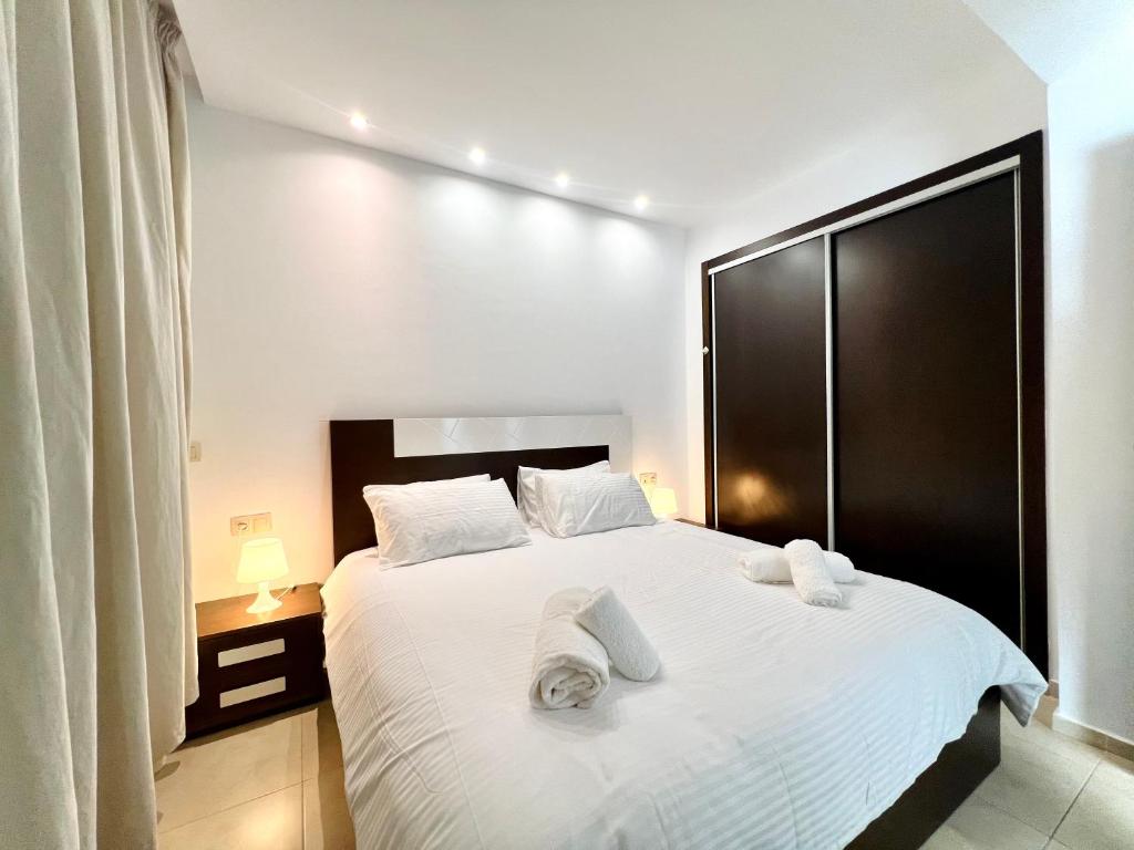 Postel nebo postele na pokoji v ubytování Blue Wave Apartment