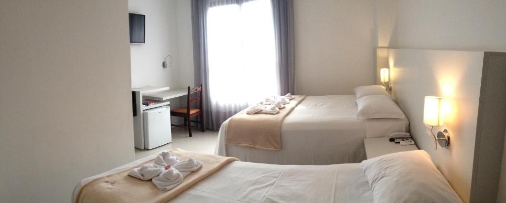Postel nebo postele na pokoji v ubytování Hotel São Mateus