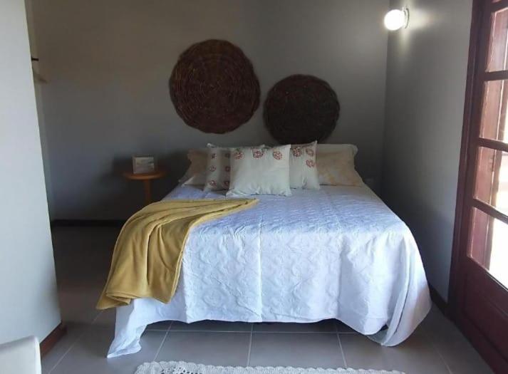 Giường trong phòng chung tại Casa capão da canoa