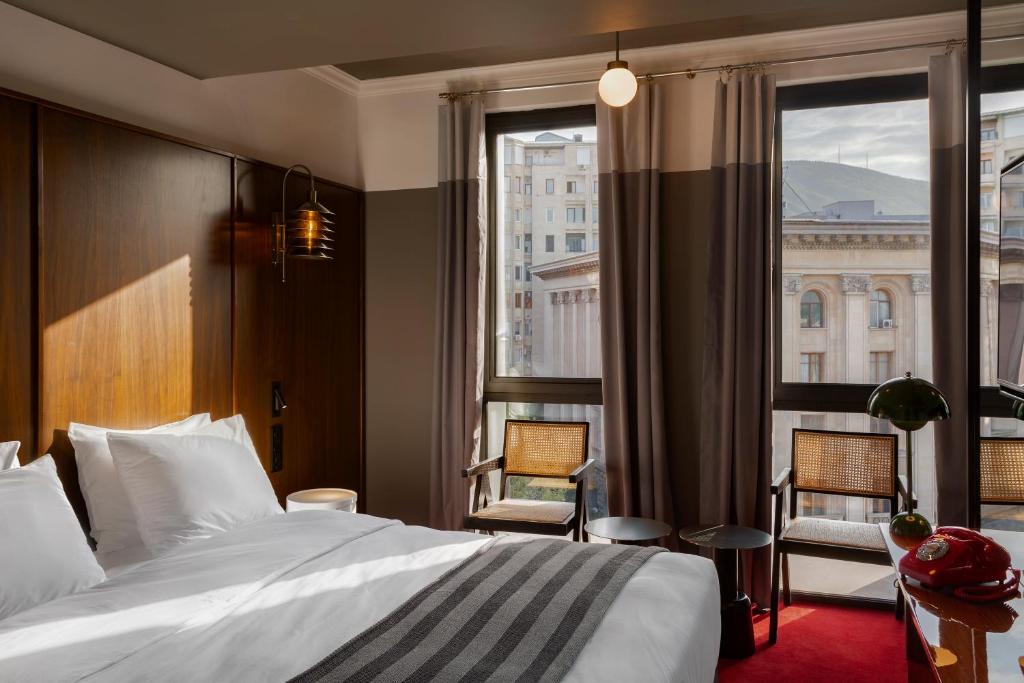 Postel nebo postele na pokoji v ubytování Hotel Afisha