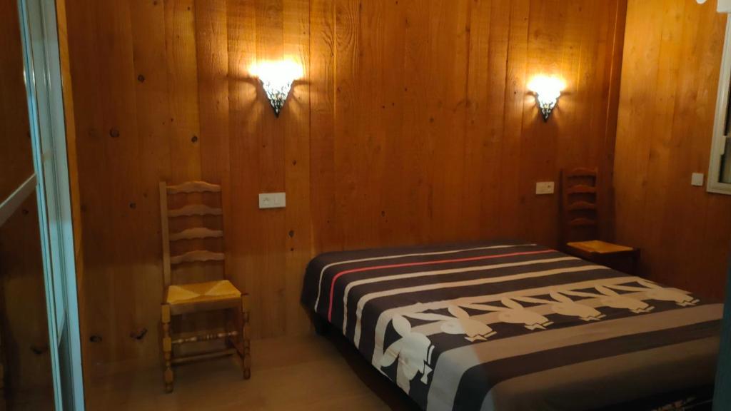 Postel nebo postele na pokoji v ubytování chalet pour amoureux à Gérardmer