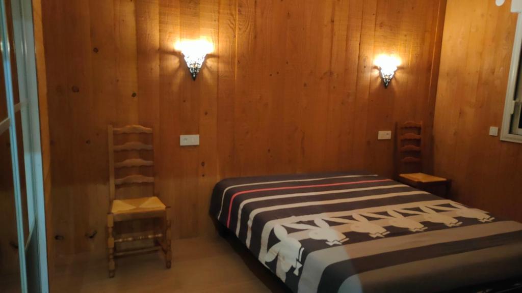 Postel nebo postele na pokoji v ubytování chalet pour amoureux à Gérardmer