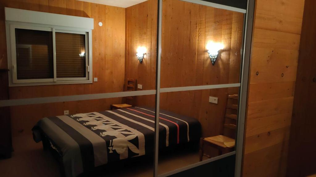 Postel nebo postele na pokoji v ubytování chalet pour amoureux à Gérardmer