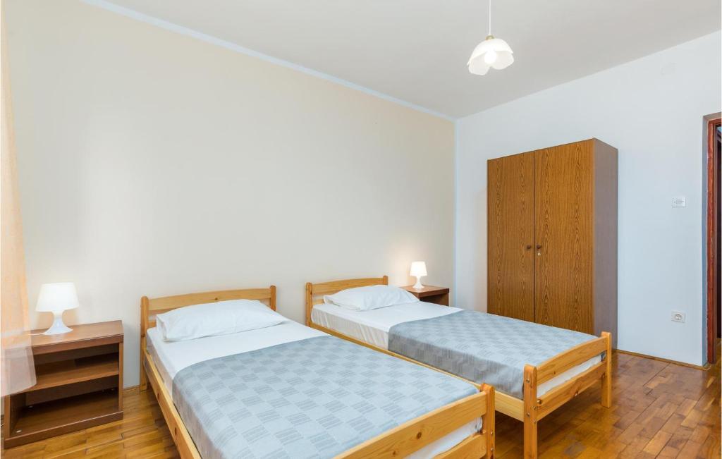 Posteľ alebo postele v izbe v ubytovaní Four-Bedroom Apartment In Fazana