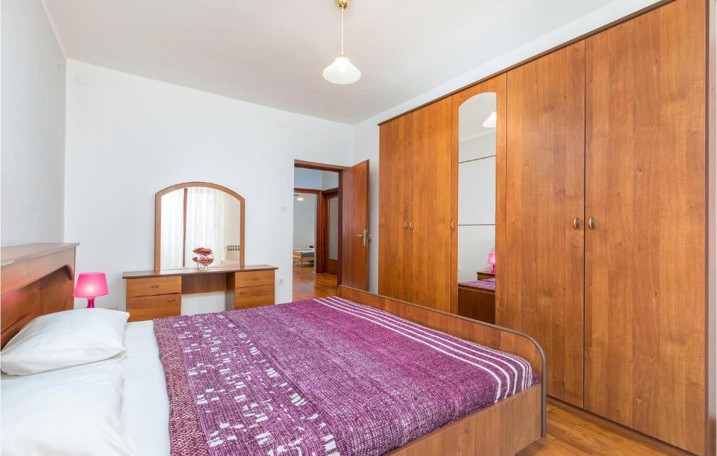 Posteľ alebo postele v izbe v ubytovaní Four-Bedroom Apartment In Fazana