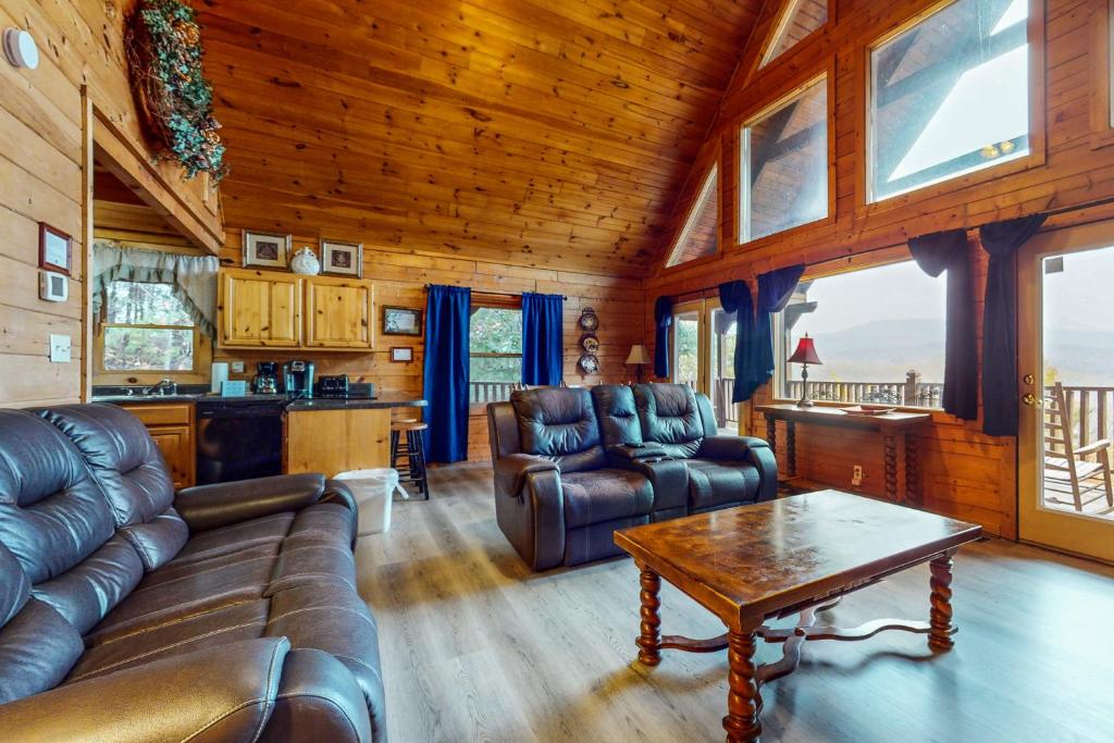 a living room with a couch and a table at Paradise Views in Sevierville
