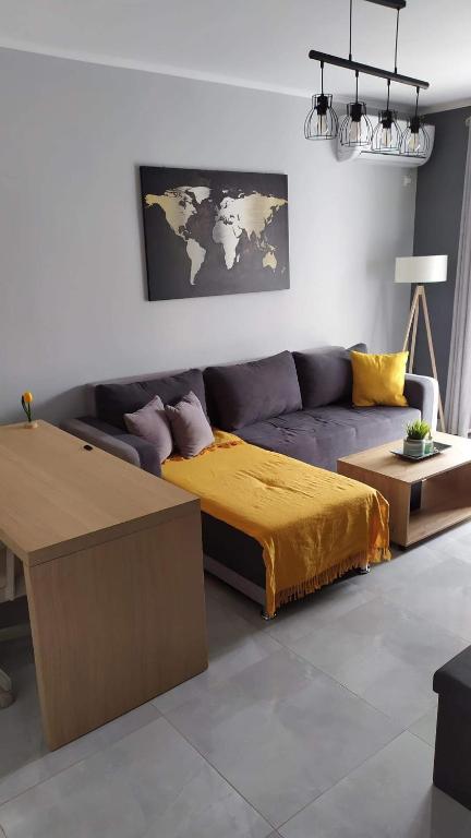 a living room with a couch and a table at Modern & Charming Mitilini in Mytilene