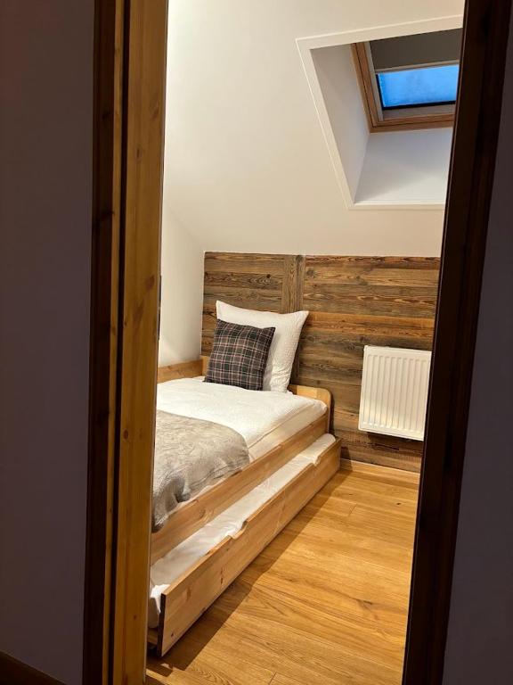 Postel nebo postele na pokoji v ubytování Hôtel des Muverans