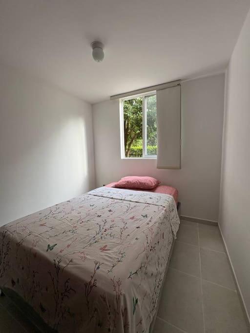Postel nebo postele na pokoji v ubytování Confort y Estilo ideal en Neiva