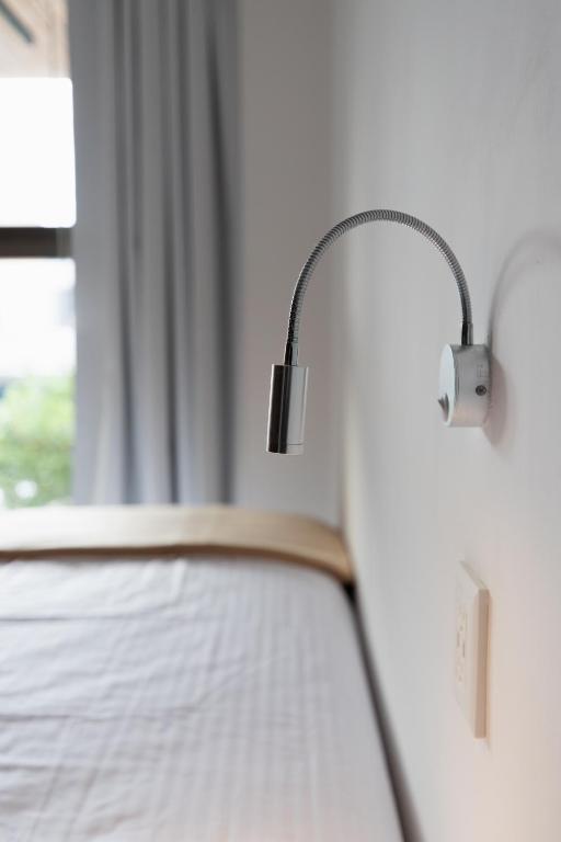 Postel nebo postele na pokoji v ubytování SUUT Hostal Boutique