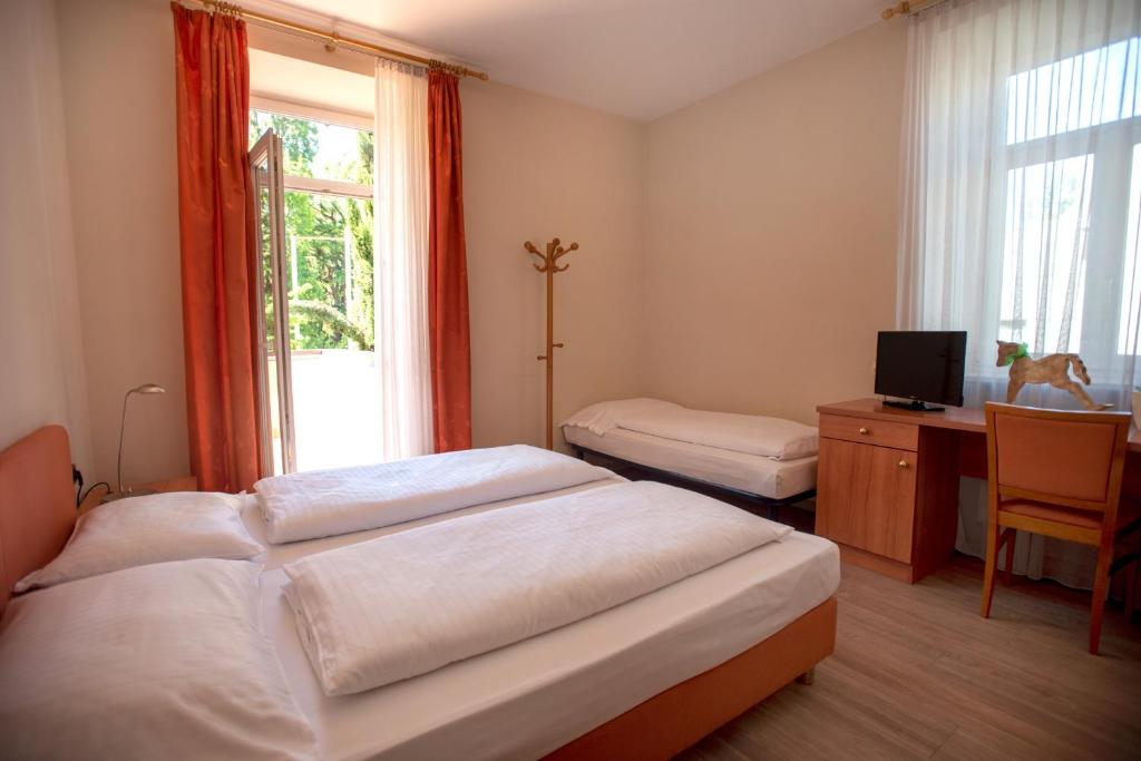 Postel nebo postele na pokoji v ubytování Albergo Cavallino s'Rössl