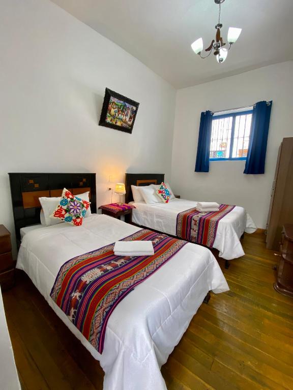 Postel nebo postele na pokoji v ubytování Amira's House Cusco