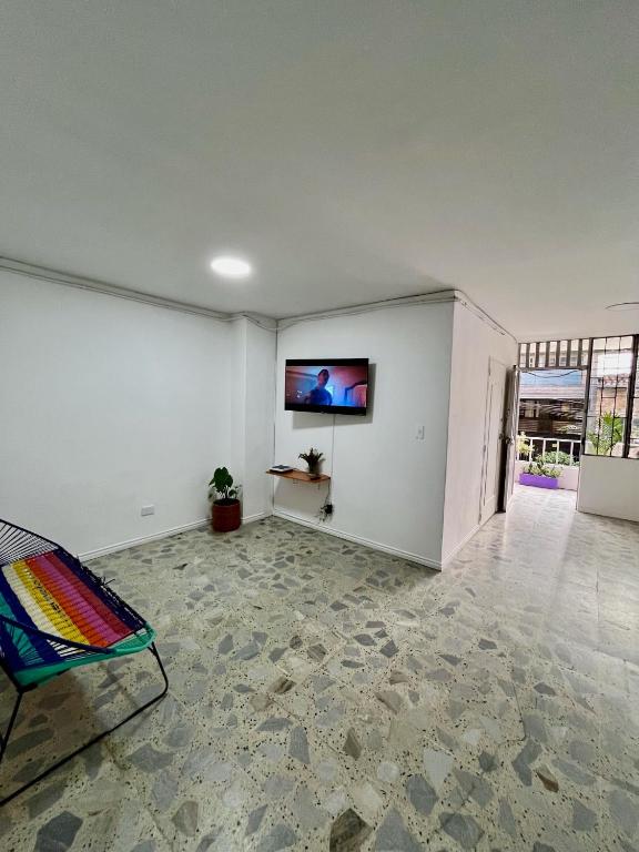 TV a/nebo společenská místnost v ubytování Entre Jardines