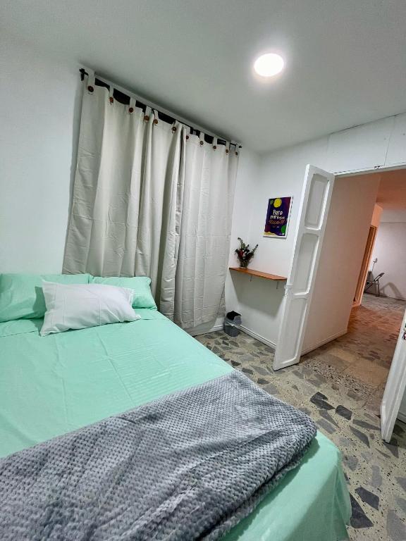 Postel nebo postele na pokoji v ubytování Entre Jardines