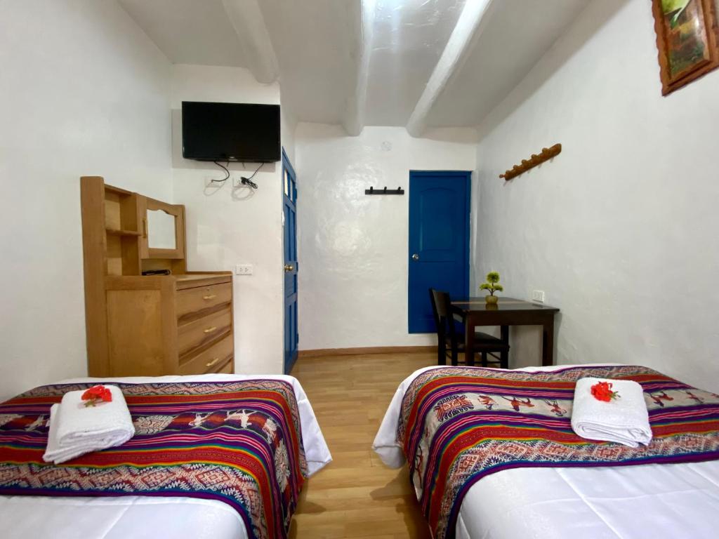 Postel nebo postele na pokoji v ubytování Amira's House Cusco