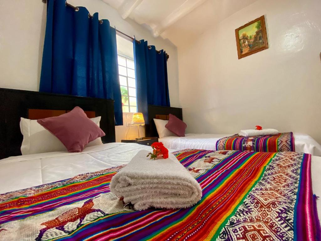 Postel nebo postele na pokoji v ubytování Amira's House Cusco