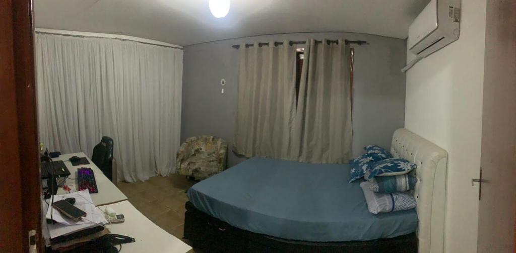 Ένα ή περισσότερα κρεβάτια σε δωμάτιο στο Casa de passeio com piscina