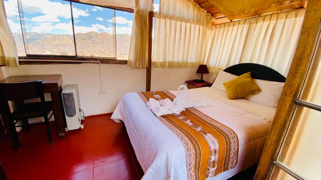 Postel nebo postele na pokoji v ubytování Amira's House Cusco