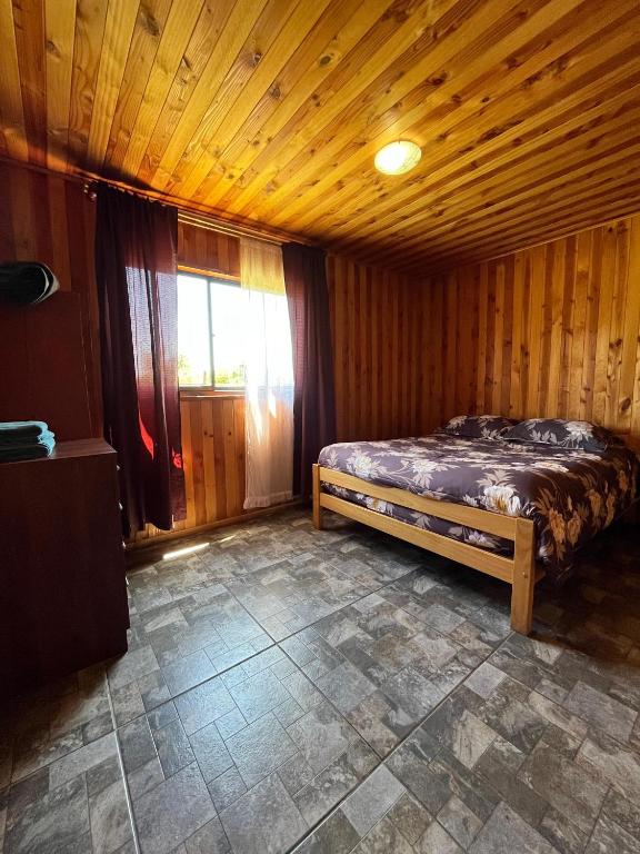 Cama o camas de una habitación en Cabañas Don Agustín Pucón