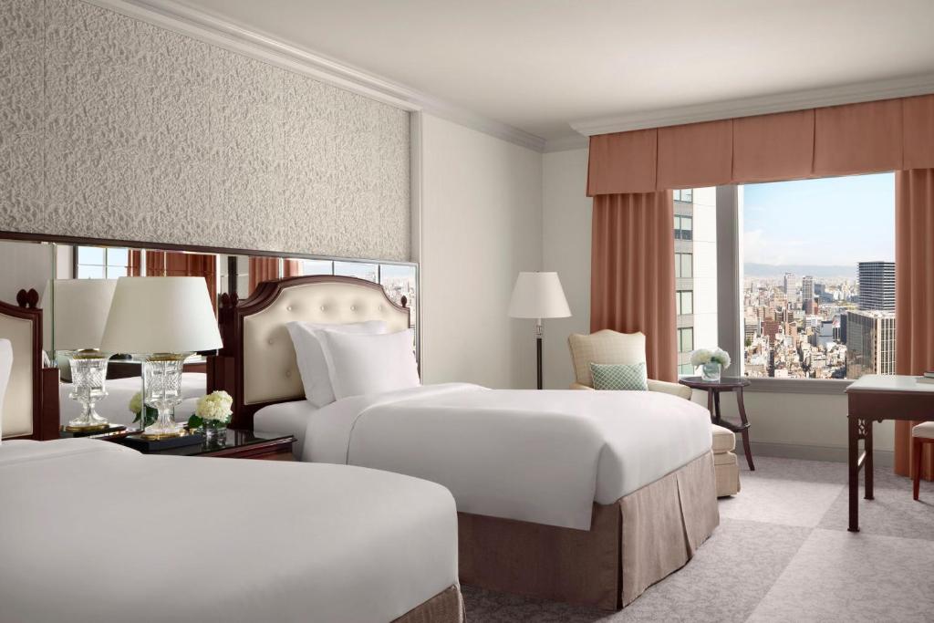 Postel nebo postele na pokoji v ubytování The Ritz-Carlton Osaka
