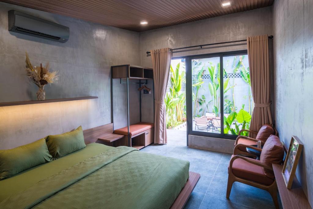 Giường trong phòng chung tại Eco House Villa