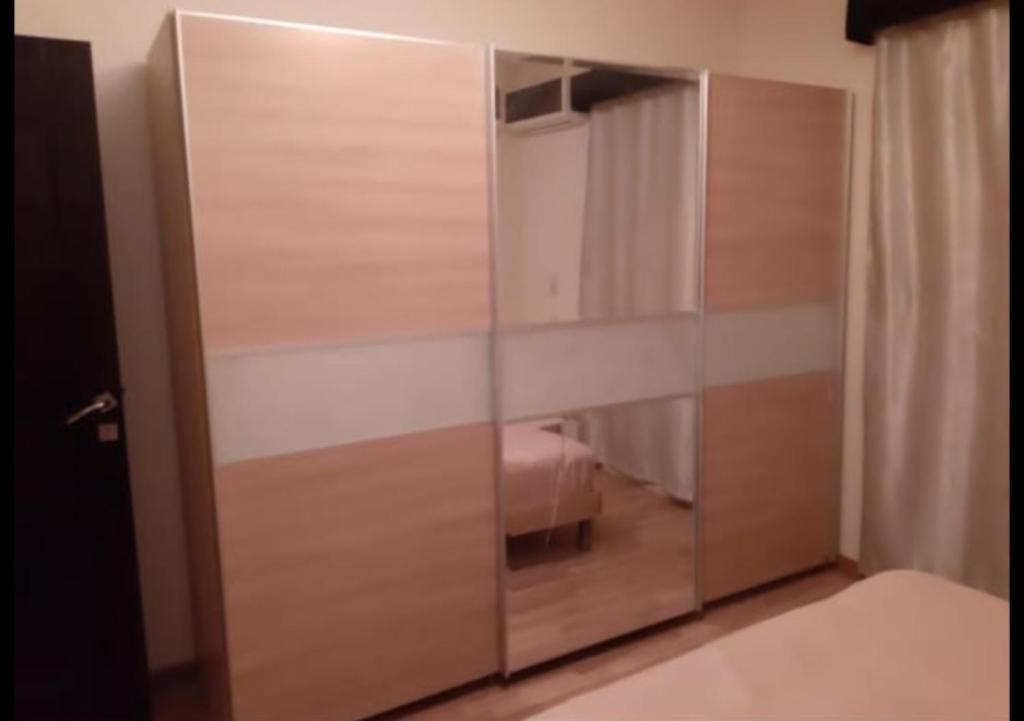Postel nebo postele na pokoji v ubytování كمبوند ذا ادرس بالشيخ زايد