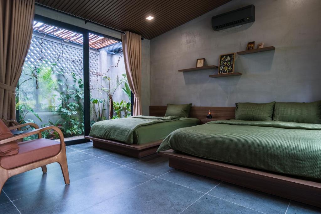 Giường trong phòng chung tại Eco House Villa