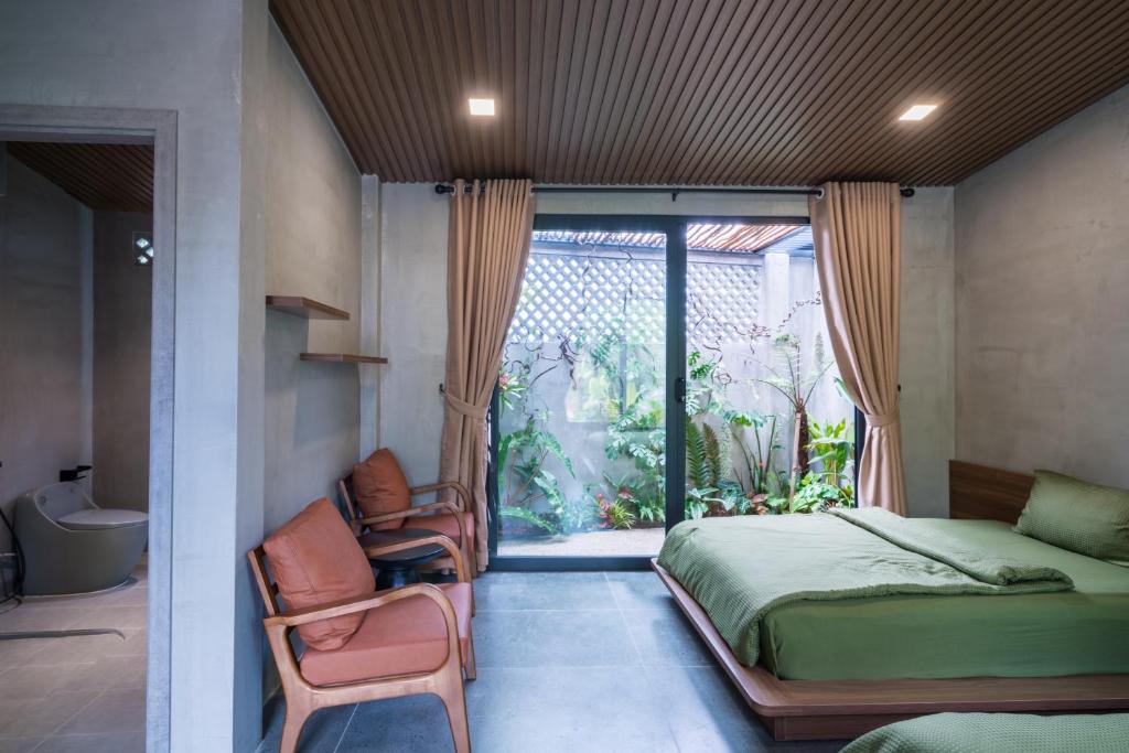 Giường trong phòng chung tại Eco House Villa