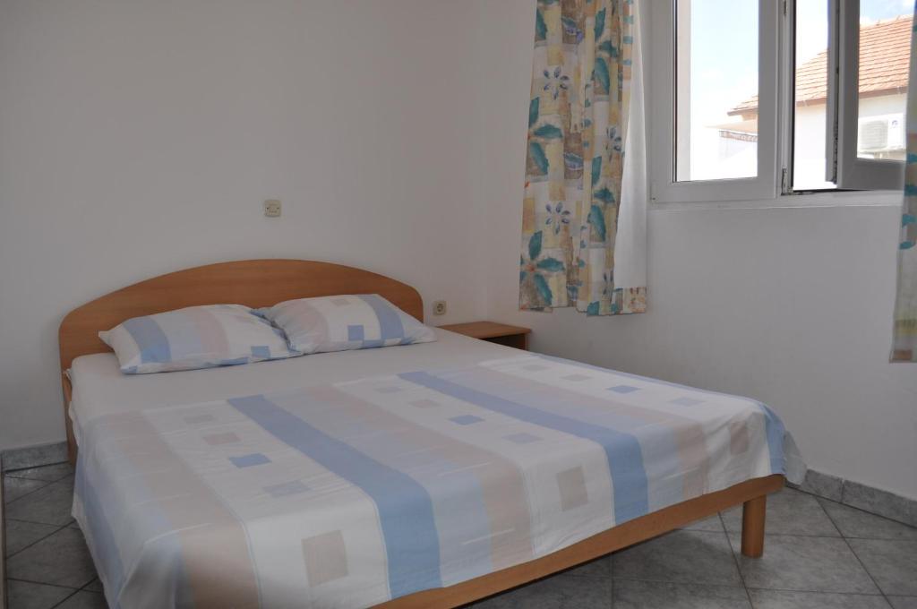 Posteľ alebo postele v izbe v ubytovaní Apartments Petar Maksan