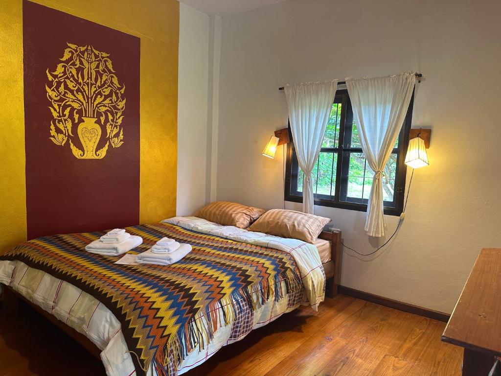 Postel nebo postele na pokoji v ubytování Pairadise Hotel