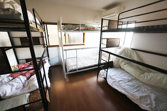 Postel nebo postele na pokoji v ubytování Mount Fuji Omotenashi Guesthouse