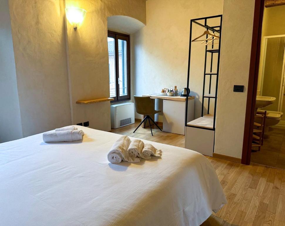 Postel nebo postele na pokoji v ubytování Il Carro Rooms - Monza Centro, Tribunale, Ospedale