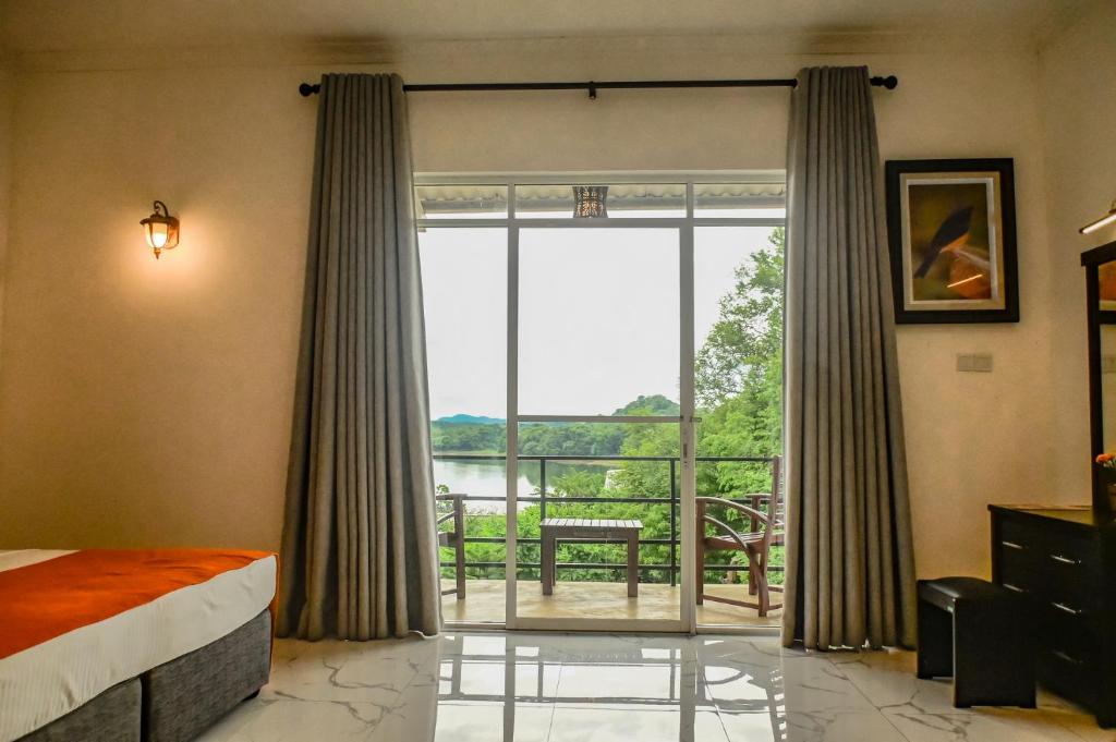 Postel nebo postele na pokoji v ubytování Agbo Hotel
