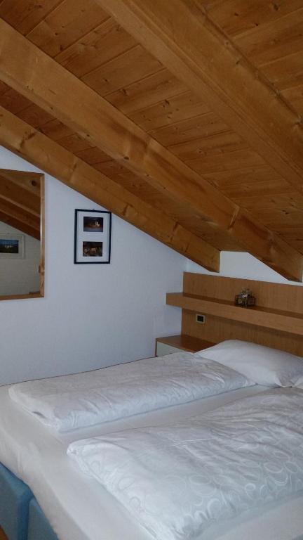 Postel nebo postele na pokoji v ubytování Chalet Karin