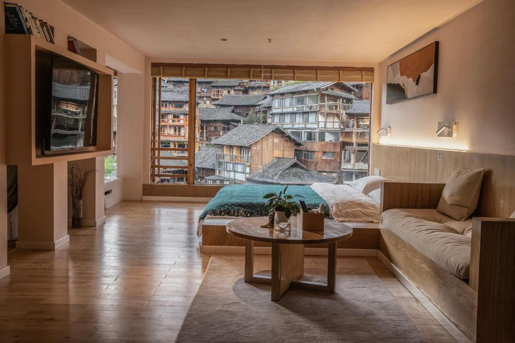 Posezení v ubytování Xijiang Qianhu Miao Village Mountain and B&B
