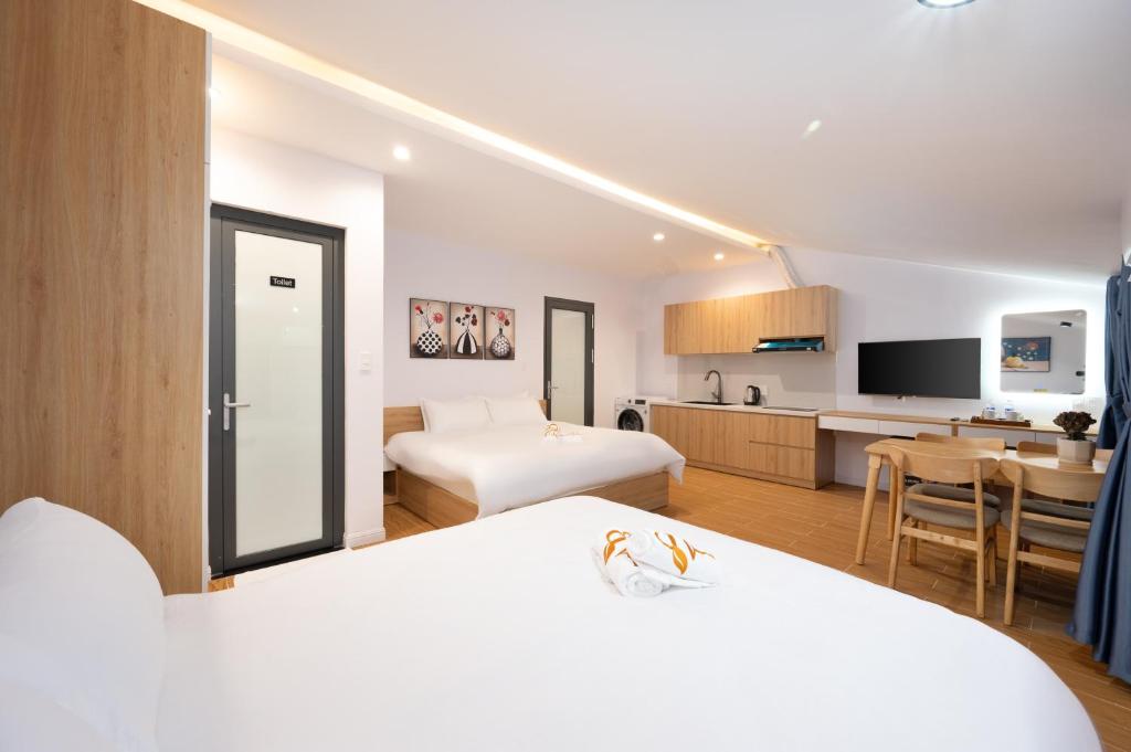 Postel nebo postele na pokoji v ubytování An Bang Spa & Apartment