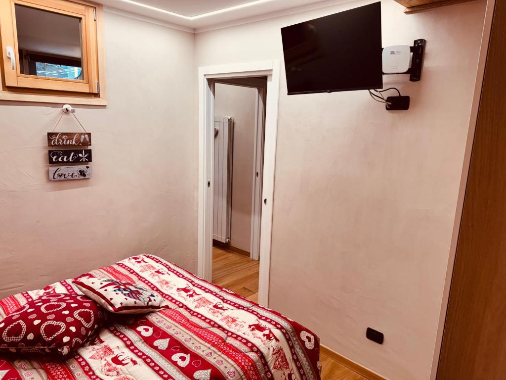 TV a/nebo společenská místnost v ubytování Residenze Vezza - Il Larice -