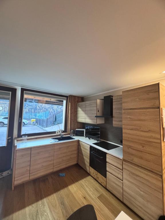 Kuchyň nebo kuchyňský kout v ubytování Residenze Vezza - Il Larice -
