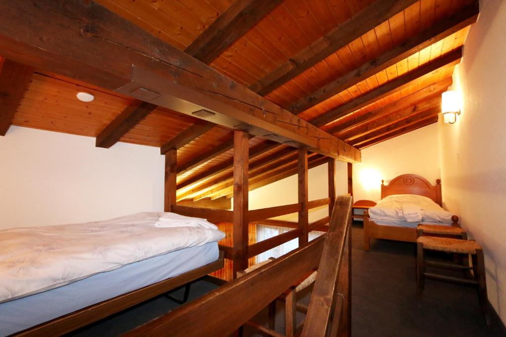 Postel nebo postele na pokoji v ubytování Sarazena