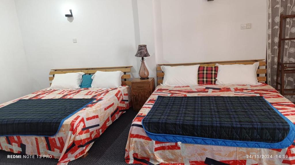 Postel nebo postele na pokoji v ubytování Aurora Echo Villa