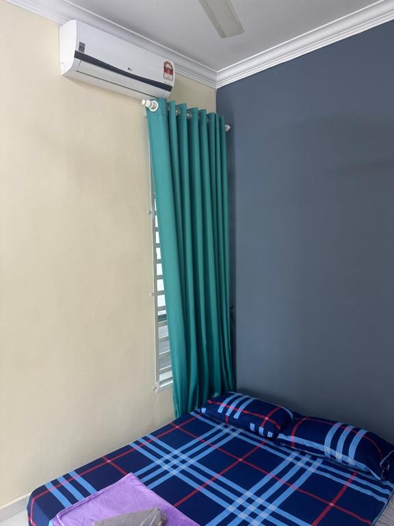 Postel nebo postele na pokoji v ubytování Ct tiara homestay