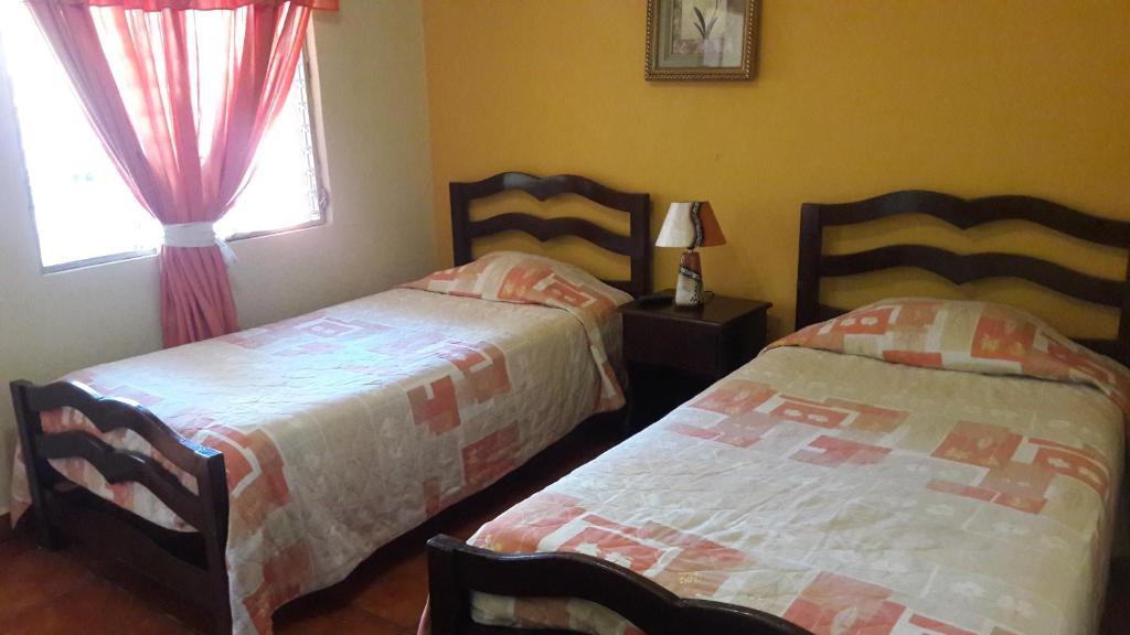 Postel nebo postele na pokoji v ubytování Hotel Brisas de Copan