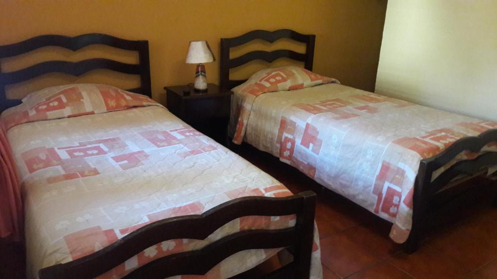 Postel nebo postele na pokoji v ubytování Hotel Brisas de Copan