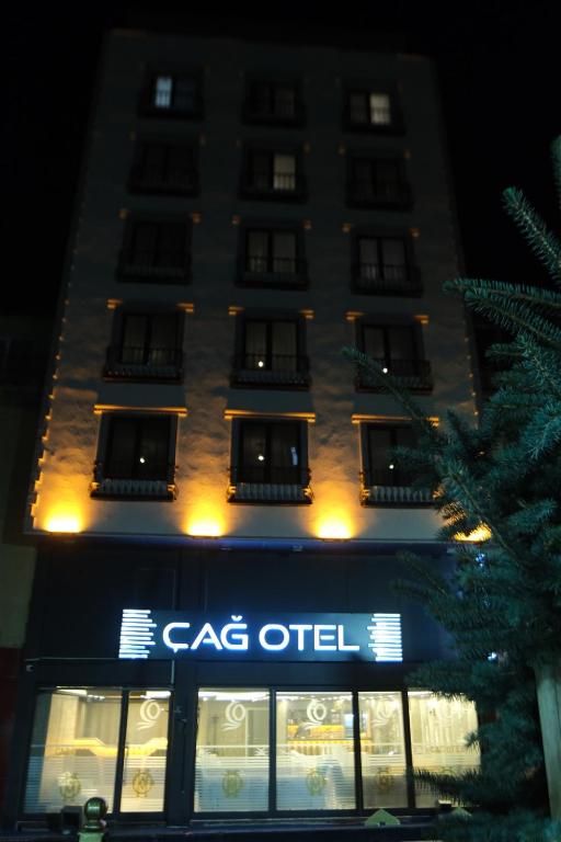 a building with a cgc oil sign in front of it at Çağ Otel in Erzurum