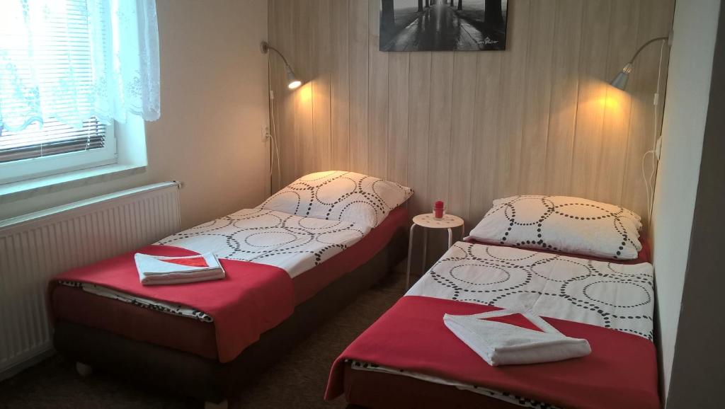 Postel nebo postele na pokoji v ubytování Penzion V Hájku