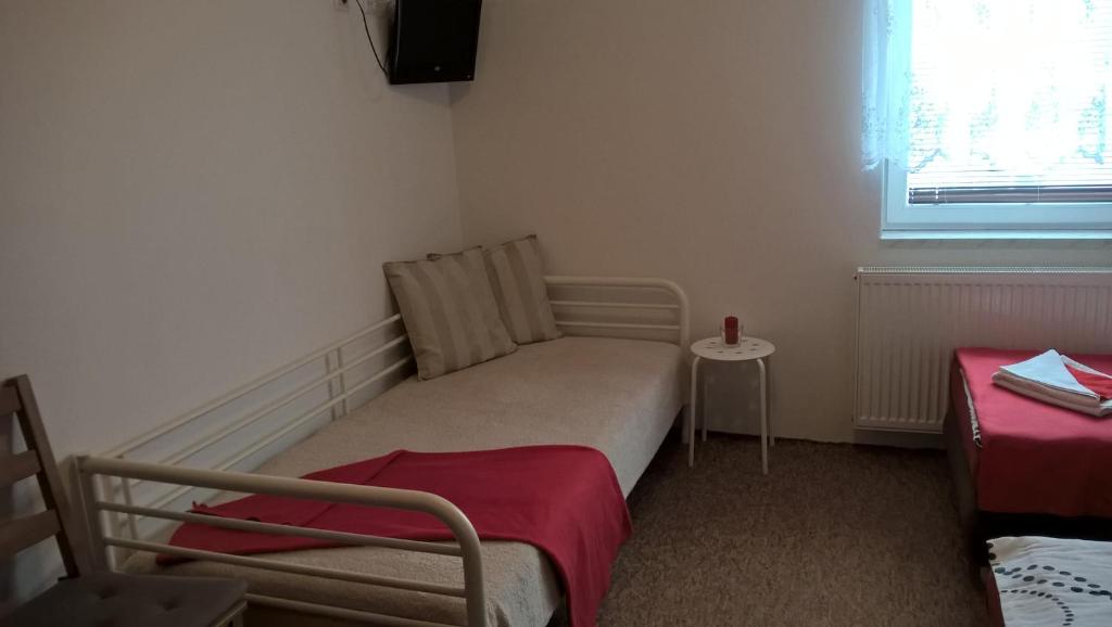 Postel nebo postele na pokoji v ubytování Penzion V Hájku