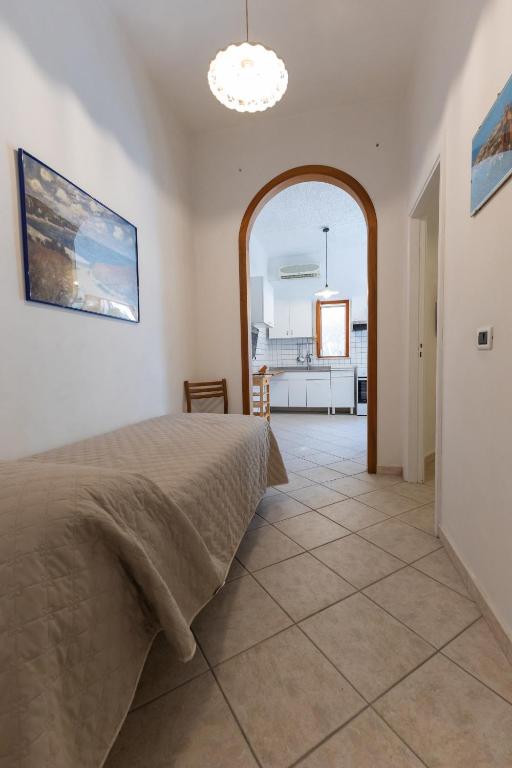 Postel nebo postele na pokoji v ubytování B&B Villa Passiaturo