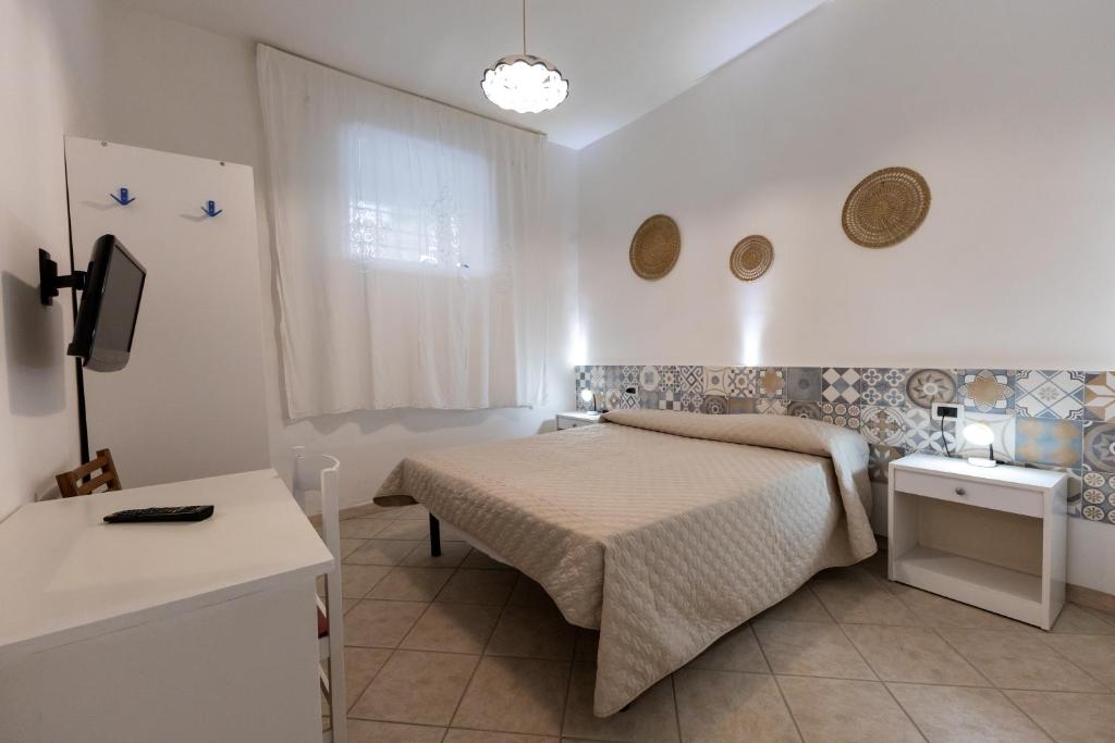 Postel nebo postele na pokoji v ubytování B&B Villa Passiaturo