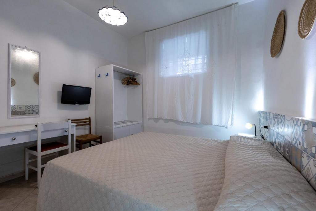 Postel nebo postele na pokoji v ubytování B&B Villa Passiaturo